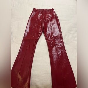 Shiny red leather pants